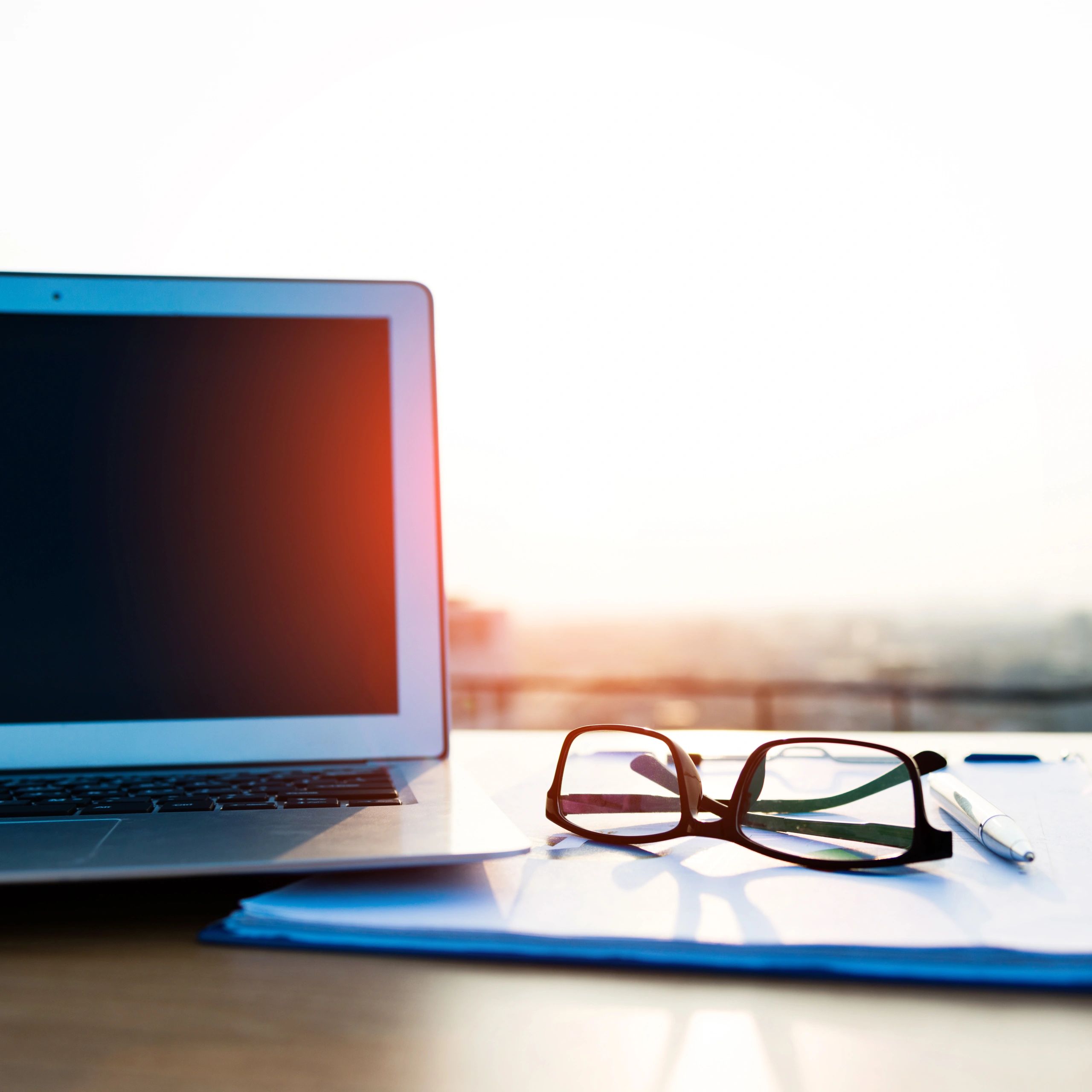 Laptop displaying financial work setup